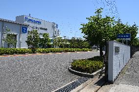 Exterior view and logo of the Panasonic Energy Suminoe Plant.